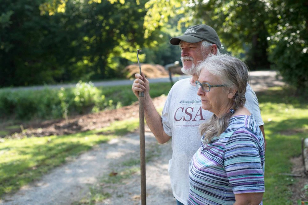 couple looking at herb garden